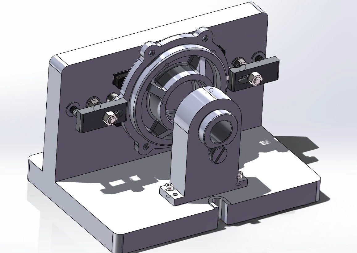 SolidWorks mechanical assembly design with rotating components and support structure.